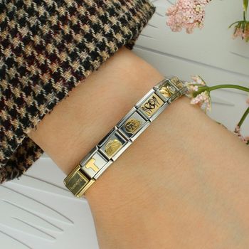 Personalizuj swoją bransoletkę Nomination! 💛 Zawieszka Link Litera T ze stali szlachetnej pokrytej 18K złotem – elegancka, trwała i z osobistym przesłaniem. Idealny prezent! 🎁 (2).jpg